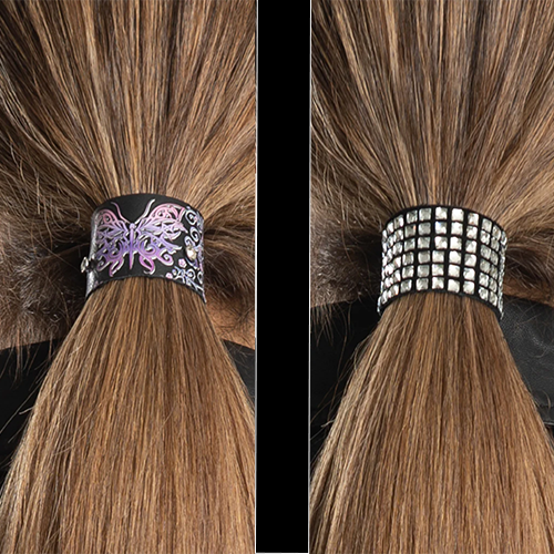 Two ponytail hair gloves, one with a purple butterfly pattern and the other adorned with bling, displayed on a ponytail.