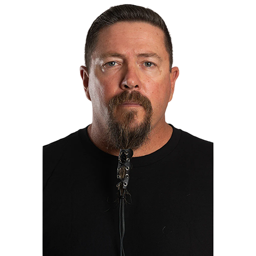 A person with a beard wearing a black full-grain leather beard glove with a lace-up design.