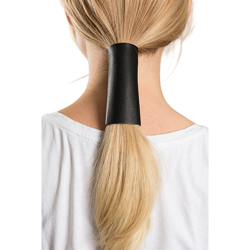 A person with a ponytail wearing a black leather hair glove.