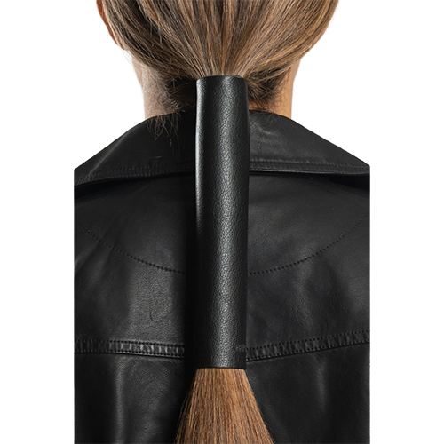 An 8 inch extra wide black leather hair glove securing thick hair in a ponytail for motorcycle riding