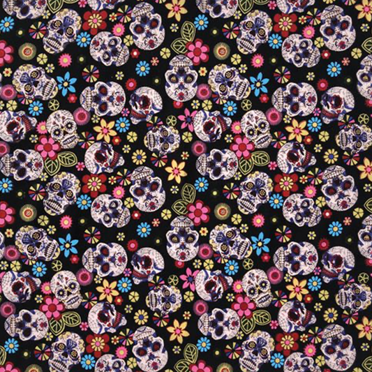 A bandana with a Day of the Dead skull and floral pattern on a black background.