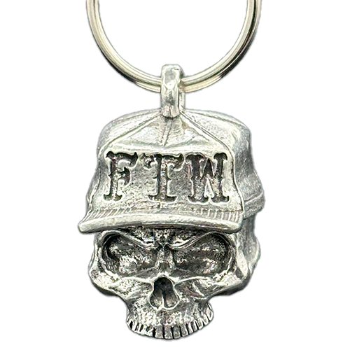 A pewter motorcycle bell with a skull wearing a trucker hat, featuring the letters 'FTW'.