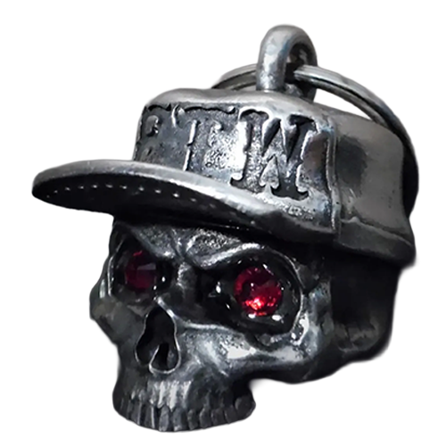 Skull charm with red eyes and a cap on a white background