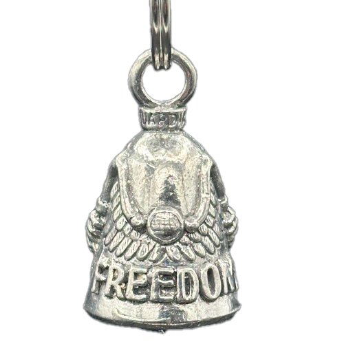 A silver bell with the word 'Freedom' inscribed on it and wings on the handlebars. The bell has a classic bell shape with a chain for attaching to a bike.