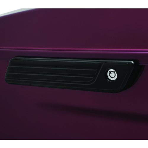 Gloss black Kuryakyn Tri-Line saddlebag hinge cover on a Harley-Davidson motorcycle