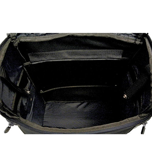 Black studded motorcycle touring bag with detachable barrel bag inside view of main compartment.