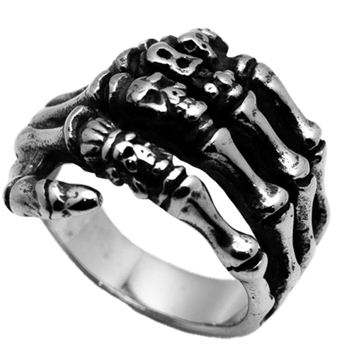 A stainless steel ring featuring a detailed skeleton hand design.