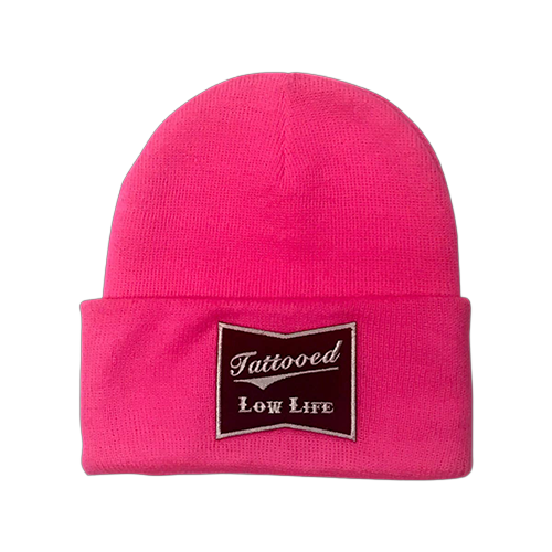 Pink beanie with a patch that says 'Tattooed Low Life'