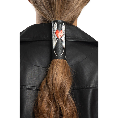 A black leather hair glove with heart and wings design securing a ponytail for motorcycle riding