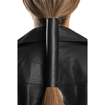 A black leather hair glove worn on a ponytail, showing the back view with the glove wrapped around the hair.