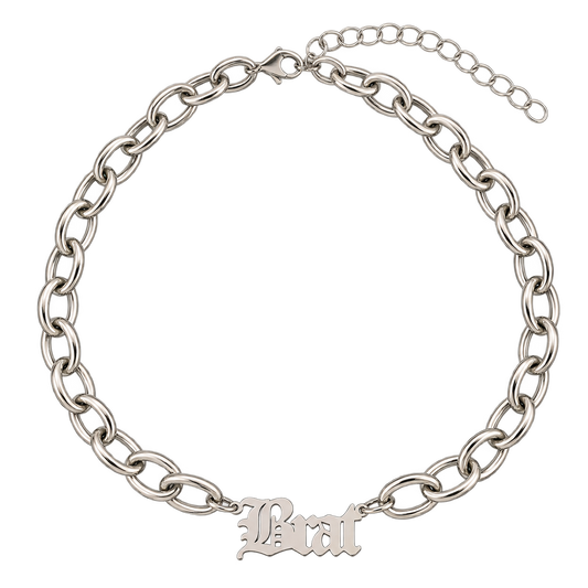 A silver-tone chain necklace with a gothic-style 'Brat' initial pendant