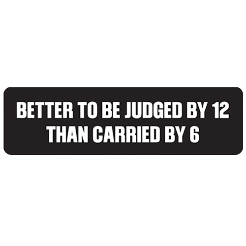 Black helmet sticker with white text reading Better To Be Judged By 12 Than Carried By 6.
