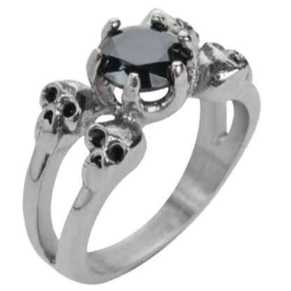 A stainless steel ring with a black cubic zirconia center stone and skull motifs on the sides.