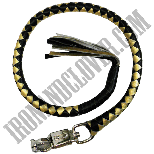 A black and yellow leather get back whip with silver-tone hardware and a quick-release grip.
