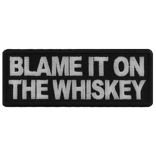 Black embroidered patch with white text reading Blame It On The Whiskey