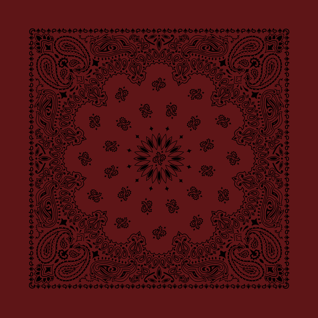 A red bandana with a black paisley pattern and rolled-hem edges.