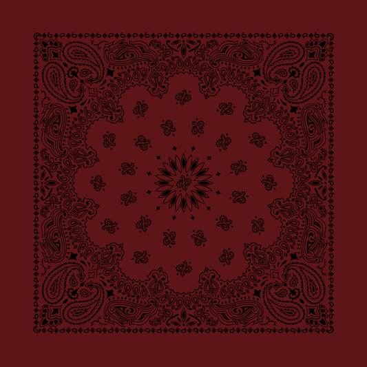 A red bandana with a black paisley pattern and rolled-hem edges.