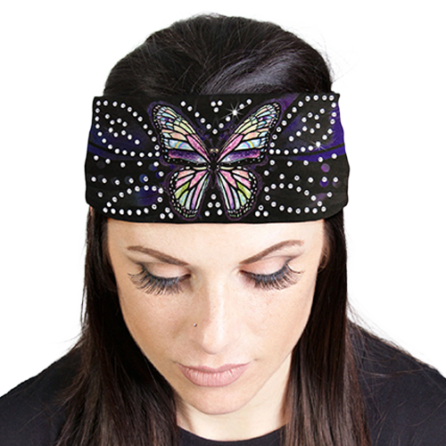 Woman wearing a headband with a butterfly design and rhinestones.
