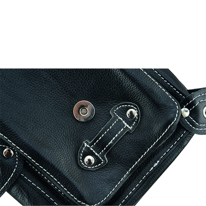Close-up of a black leather bag with metal hardware
