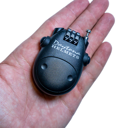Small black combination lock held in a hand.