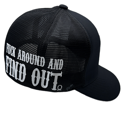 A black FlexFit hat with a structured design and a white slogan printed on the side.