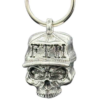 A pewter motorcycle bell with a skull wearing a trucker hat, featuring the letters 'FTW'.