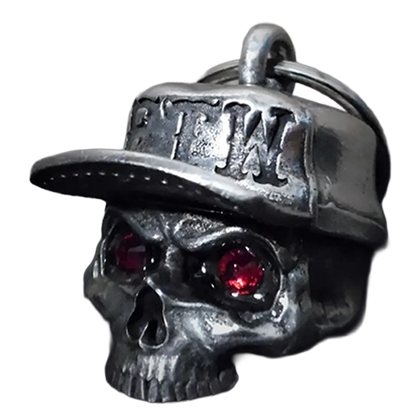Skull charm with red eyes and a cap on a white background