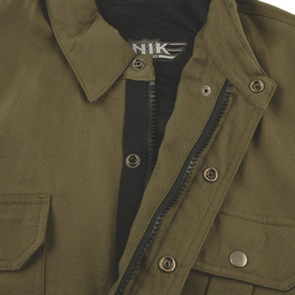 Close-up of an olive green utility jacket with a black inner lining
