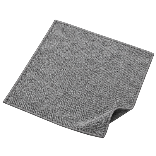 A gray microfiber cleaning cloth with a textured terry-like surface, shown unfolded with one corner curled over