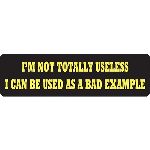 A black helmet sticker with the text 'I'M NOT TOTALLY USELESS I CAN BE USED AS A BAD EXAMPLE' in yellow letters.
