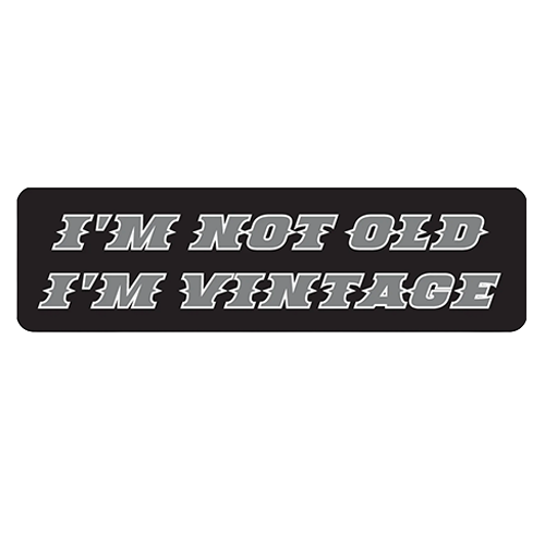 Black helmet sticker with gray text reading I'm not old I'm vintage