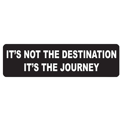 Black helmet sticker with white text reading it's not the destination it's the journey