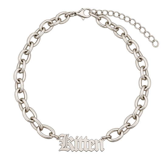 A silver-toned chain bracelet with a central script nameplate reading 'Kitten' and an extender chain with clasp