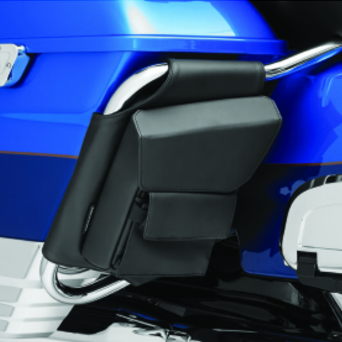 Black rigid vinyl motorcycle storage pouches mounted on saddlebag guards
