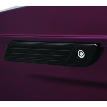 Gloss black Kuryakyn Tri-Line saddlebag hinge cover on a Harley-Davidson motorcycle