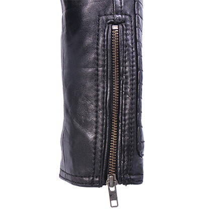 Close-up of antiqued YKK zippers on womens leather jacket cuff