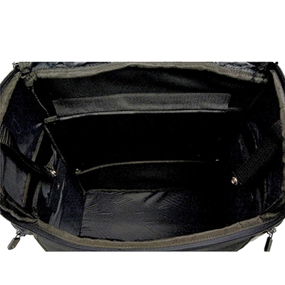 Black studded motorcycle touring bag with detachable barrel bag inside view of main compartment.