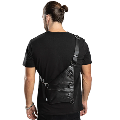 Man wearing a black leather crossbody bag.