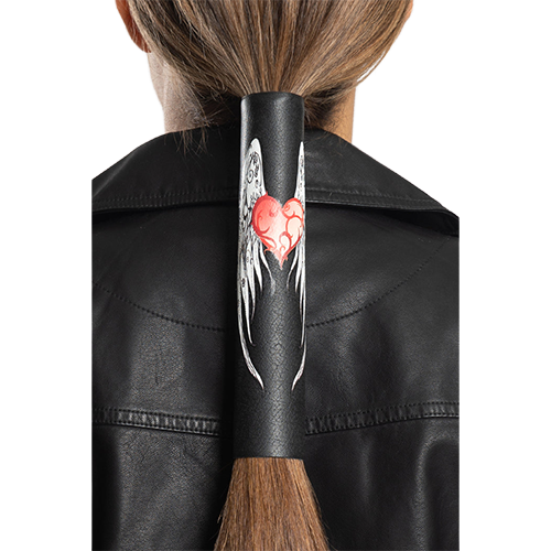 An 8 inch black leather hair glove with heart and wings design securing long hair in a ponytail