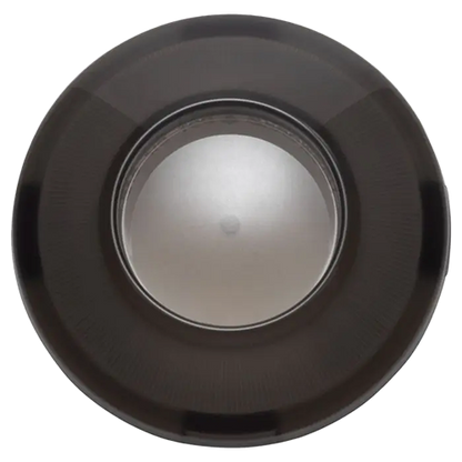 A smoked lens cover for Harley motorcycles, typically used as a turn signal cover, with a visible central bullet style lens.