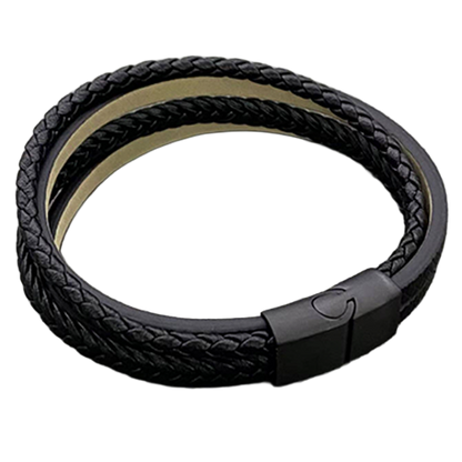 Fastened black multi-layer bracelet showing the compact clasp and layered leather construction.