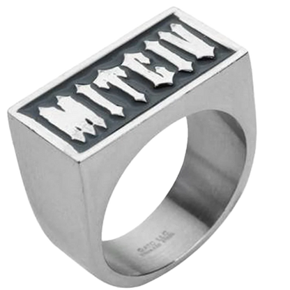A stainless steel ring with the word 'VICTIM' spelled backward in bold black enamel on the top surface.