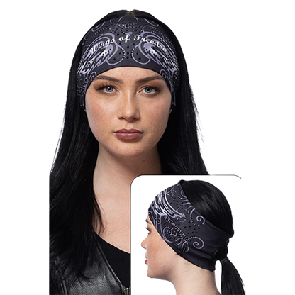 A woman wearing a black headband with a wings of freedom design and sparkling gemstones.