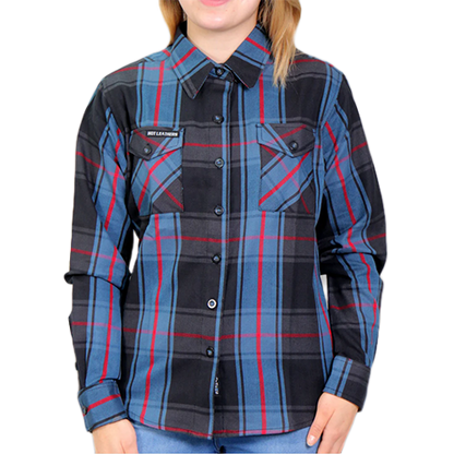 A woman wearing a blue, red, and black checkered flannel shirt with long sleeves and a collar.