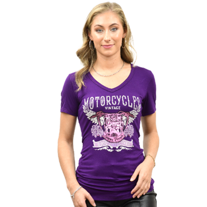 A woman wearing a purple V-neck shirt with a bold motorcycle graphic design.