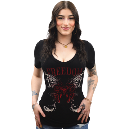 A woman wearing a black V-neck tee with a graphic of freedom wings and roses.