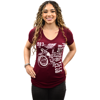 Woman wearing maroon Women’s Route 66 Club Shirt with distressed motorcycle graphic and V-neck front