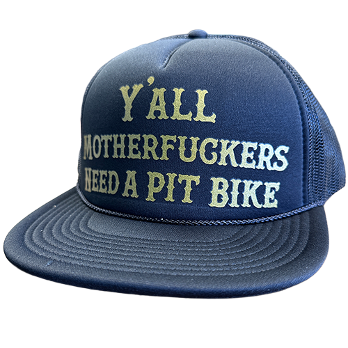 A black snapback hat with gold text that reads 'Y'ALL MOTHERFUCKERS NEED A PIT BIKE' on the front panel.