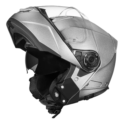 A silver metallic modular motorcycle helmet with dual shields and DOT approval.